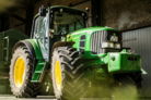 green-and-yellow-tractor-in-garage.jpg green and yellow tractor in garage